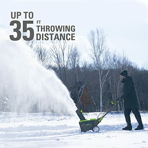 Person using a snow blower in snowy landscape